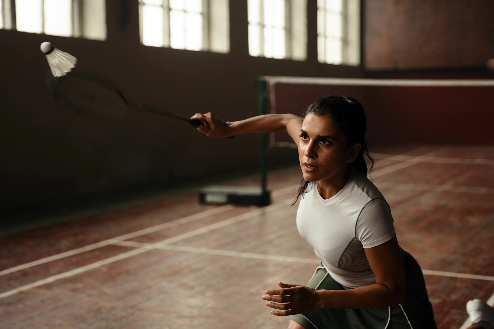 Tulasi Rao reaching for a badminton shot